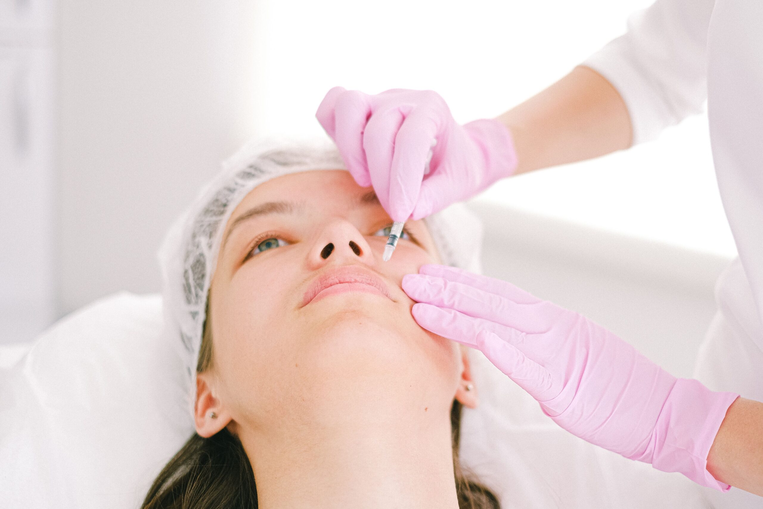 Woman receiving Sculptra treatment for firmer skin after weight loss
