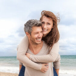 man-and-women-on-beach-400x250